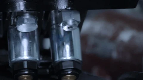 Industrial pattern of equipment. Nuts twisted on unit. Metal connectors Vídeos de archivo 98683460