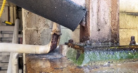 Industrial Pipe Leaking And Steaming With Algae Growing On I Beam Stock Footage 118013865