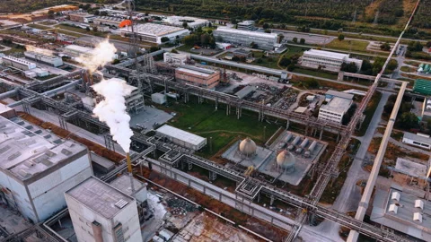 Industrial pipe network with steam stacks and vessels. Oblique aerial view of Stock Footage 339368447