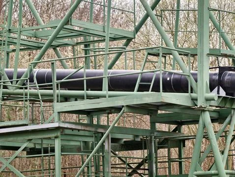 Industrial Pipe Pathway. Robust Green Platform Supports Insulated Piping Wi.. Stock Photos