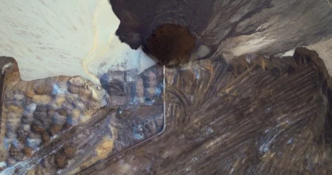 Industrial pipe spraying mixture of water and sediment at mining area, part of Stock Footage 329141858