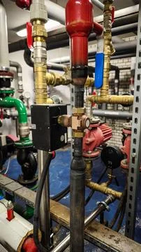 Industrial pipe system technical room plumbing maintenance Stock Photos