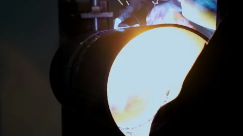 Industrial pipe welding inside pipeline during metal fabrication process. 스톡 동영상 347777872