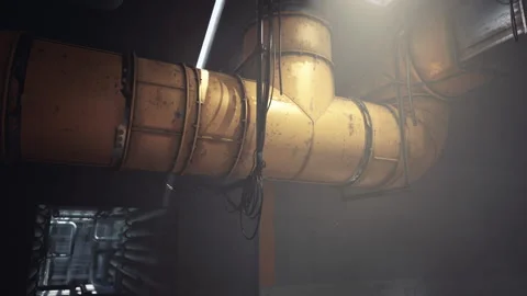Industrial pipes create an atmospheric setting in a dimly lit corridor Stock Footage 331422269