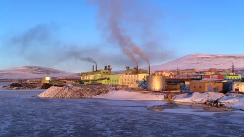 Industrial plant polluting the arctic environment with smoke Stock Footage 337038698