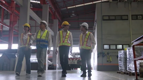 Industrial plant workers begin their day as they walk into work. Stock Footage 252568200