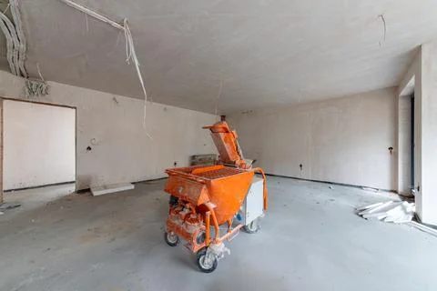 Industrial Plastering Machine at a Construction Site. Professional equipmen.. Stock-Fotos