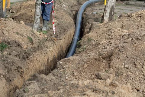 Industrial plastic polypropylene pipe on the construction site for laying s.. Stock Photos
