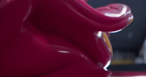 Industrial plastic red mixture blending in the machinery, slow motion Stock Footage 154798625