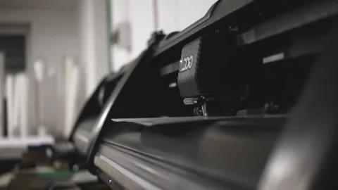 Industrial plotter for cuttering paper in print shop. Print production concept Stock Footage 168183620