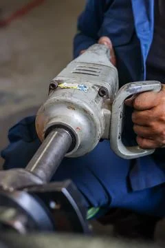 Industrial pneumatic tapping machine in workshop. Stock Photos
