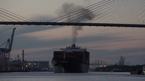Industrial pollution as container ship leaves port of savannah at sunset, ga, Stock Footage 44937045