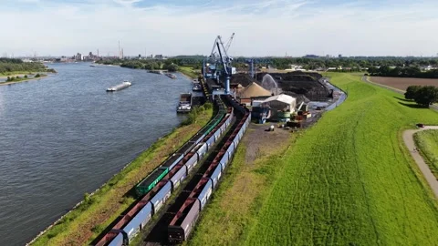 Industrial port unloading bulk cargo into freight train Stock Footage 337448143