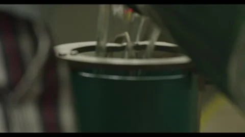 Industrial pouring liquid into container + focus pulling Stock Footage 57082905