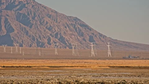Industrial power lines cutting through barren desert Stock-Footage 326236133