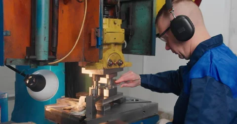 Industrial press machine producing metal parts in factory workshop Stock Footage 337774041