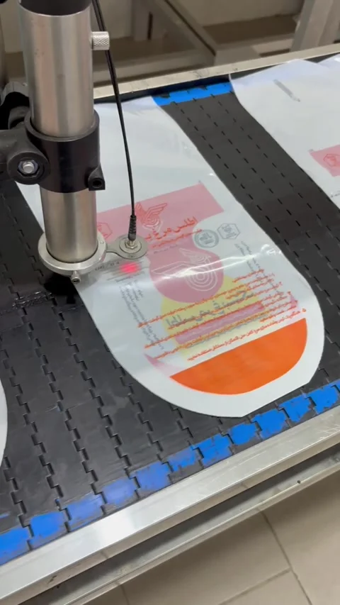 Industrial printer device stamping packaged chicken in plant, vertical Stock Footage 345164677