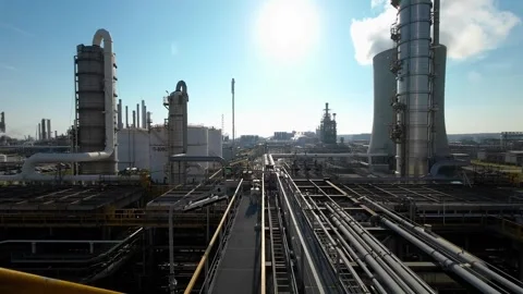 Industrial processing plant in backlight with massive towers Stock Footage 345626211