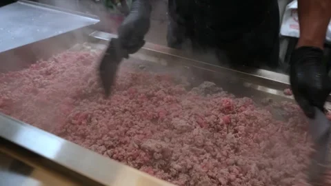 Industrial processing of raw ground beef or minced meat in a large commercial mi Stock Footage 331636421