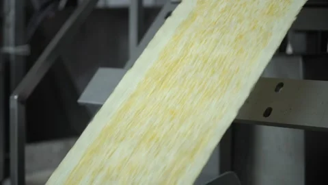 Industrial production of rectangular potato chips on factory conveyor Stock Footage 250311684