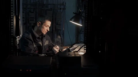 Industrial professional worker engineer develops circuit chip by soldering tool Stock Footage 124253830
