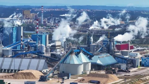 Industrial pulp and paper mill plant emitting smoke and steam Stock Footage 340311511