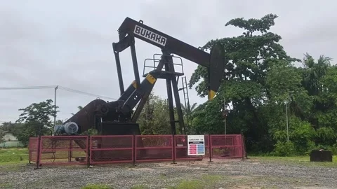 Industrial pumpjack with the text "BUKAKA" Stock Footage 336674993