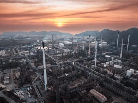 Industrial Refinery Complex Under Sunset Sky Wide Shot Stock Photos