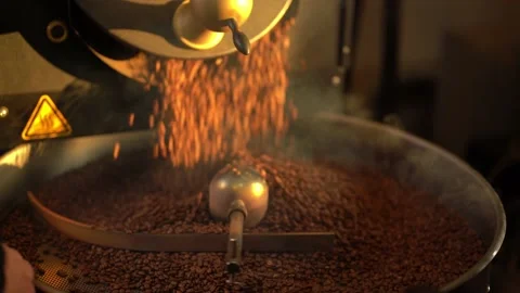 Industrial roasting machine spinning roasted coffee beans Stock Footage 234629361