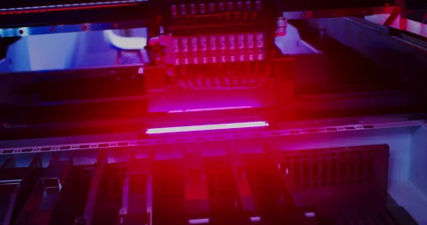 Industrial robot assembles an electronic board Stock Footage 307210389