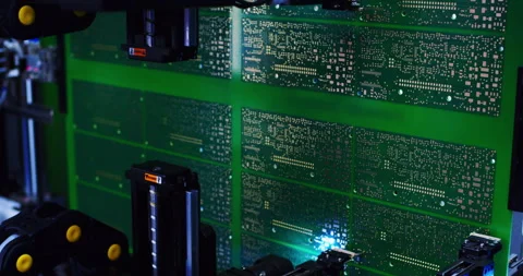 Industrial robot assembles an electronic board. Stock Footage 307285736