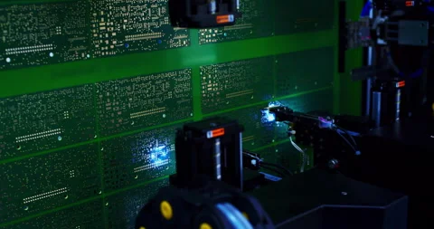 Industrial robot for electronics manufacturing makes a circuit board Video stock 307532283