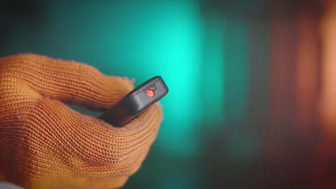 Industrial Robot Remote Controller in Worker's Hand. Smart Factory Automation Stock Footage 301416068