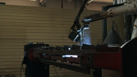 Industrial Robot Welding Metal Frames in Metal Fabrication Shop Stock Footage 320675069