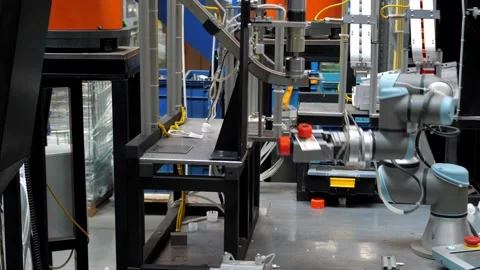 Industrial robot at work in the factory of plastic products. Stock Footage 139903867
