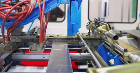 Industrial robotic arm assembling metal parts in a factory Stock Footage 316608098
