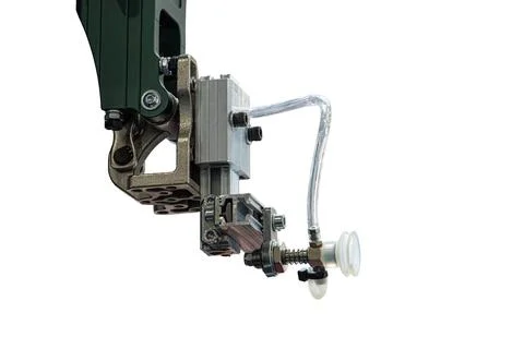 Industrial robotic arm end effector equipped with a vacuum suction cup system Stock Photos