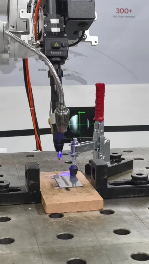 Industrial robotic arm equipped with a precision laser cutting head Stock-Footage 336838795