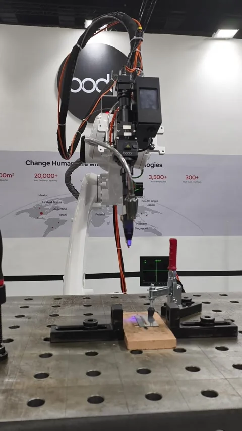 Industrial robotic arm equipped with a precision laser cutting head Stock-Footage 336838799