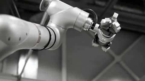 Industrial robotic arm with gripper operating in automated factory. Vídeos de archivo 330216850