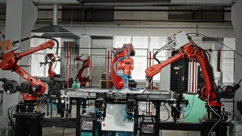 Industrial Robotic Arms Work In Harmony To Weld And Assemble Various Metal Stock Footage 323792293