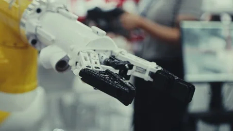 Industrial Robotics Engineer Expertly Programs a Hand with New Equipment. Stock Footage 247711622