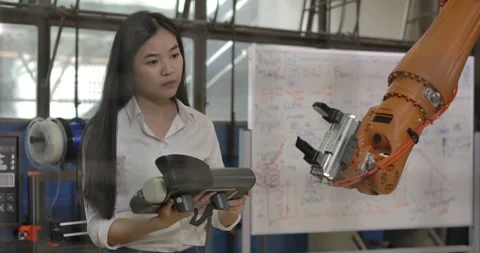 Industrial Robotics Engineer is Testing ... | Stock Video | Pond5