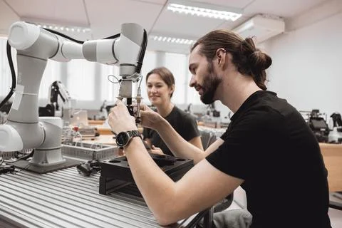 Industrial Robotics program university students learning education mechanic.. Stock Photos