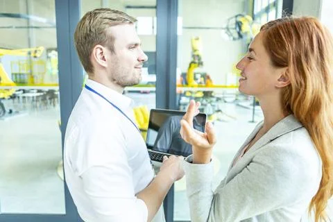 Industrial Robots Advice Engineers developing AI for industrial robots.  Stockfoto's
