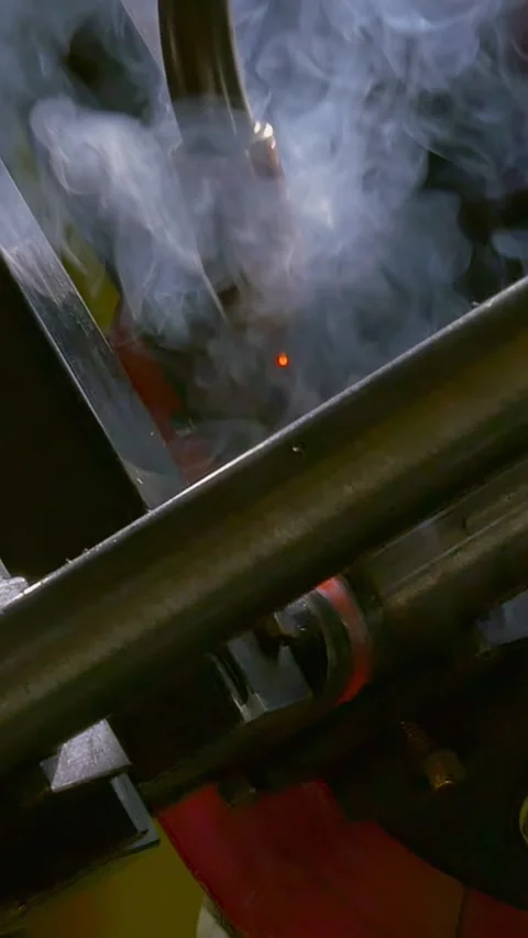 Industrial Robot's Brilliant Argon Pipe Fusion a Smoky Symphony Stock Footage 344606737
