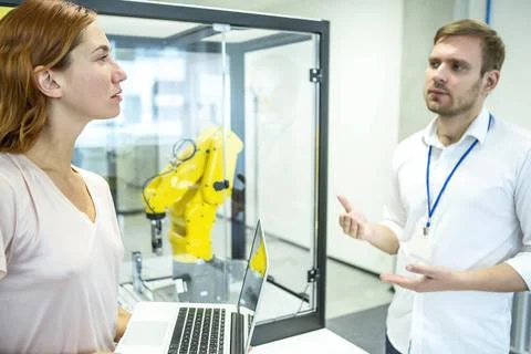 Industrial Robots Development An engineer developing the industrial robot.... Foto stock