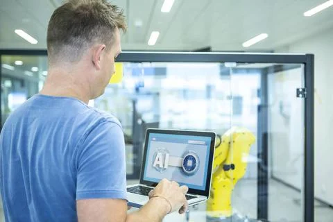 Industrial Robots Development An engineer developing the industrial robot.... Foto stock