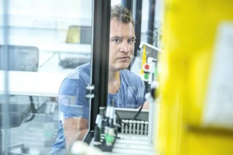 Industrial Robots Development An engineer developing the industrial robot.... Stock Photos