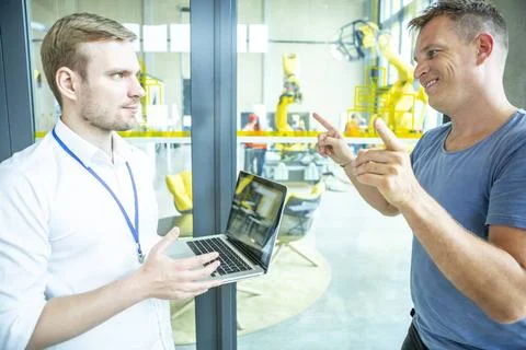 Industrial Robots Development Engineers in the development of industrial r... 스톡 사진